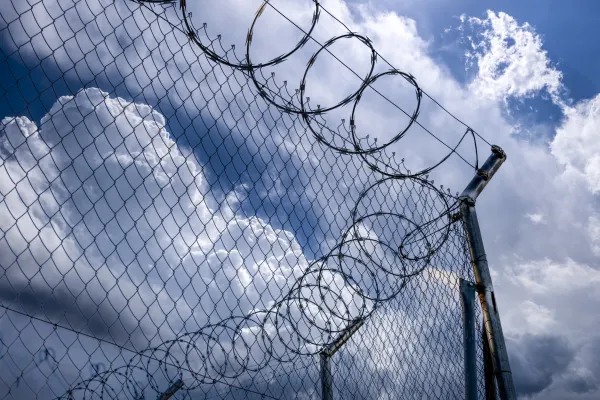 Stock image of barbed wire at a corrections facility. Photo credit: Getty Images.