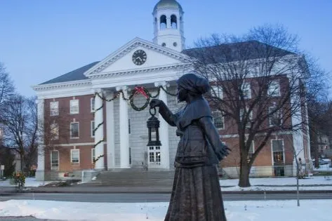 Auburn City Hall decorated for the holidays with a statue of Harriet Tubman in the foreground. Photo credit: City of Auburn via Facebook.
