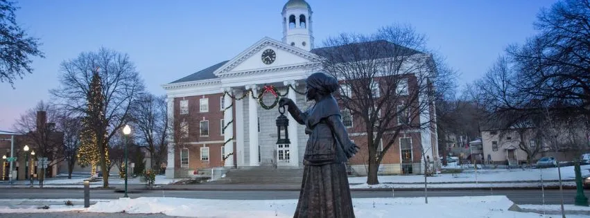 Auburn City Hall decorated for the holidays with a statue of Harriet Tubman in the foreground. Photo credit: City of Auburn via Facebook.