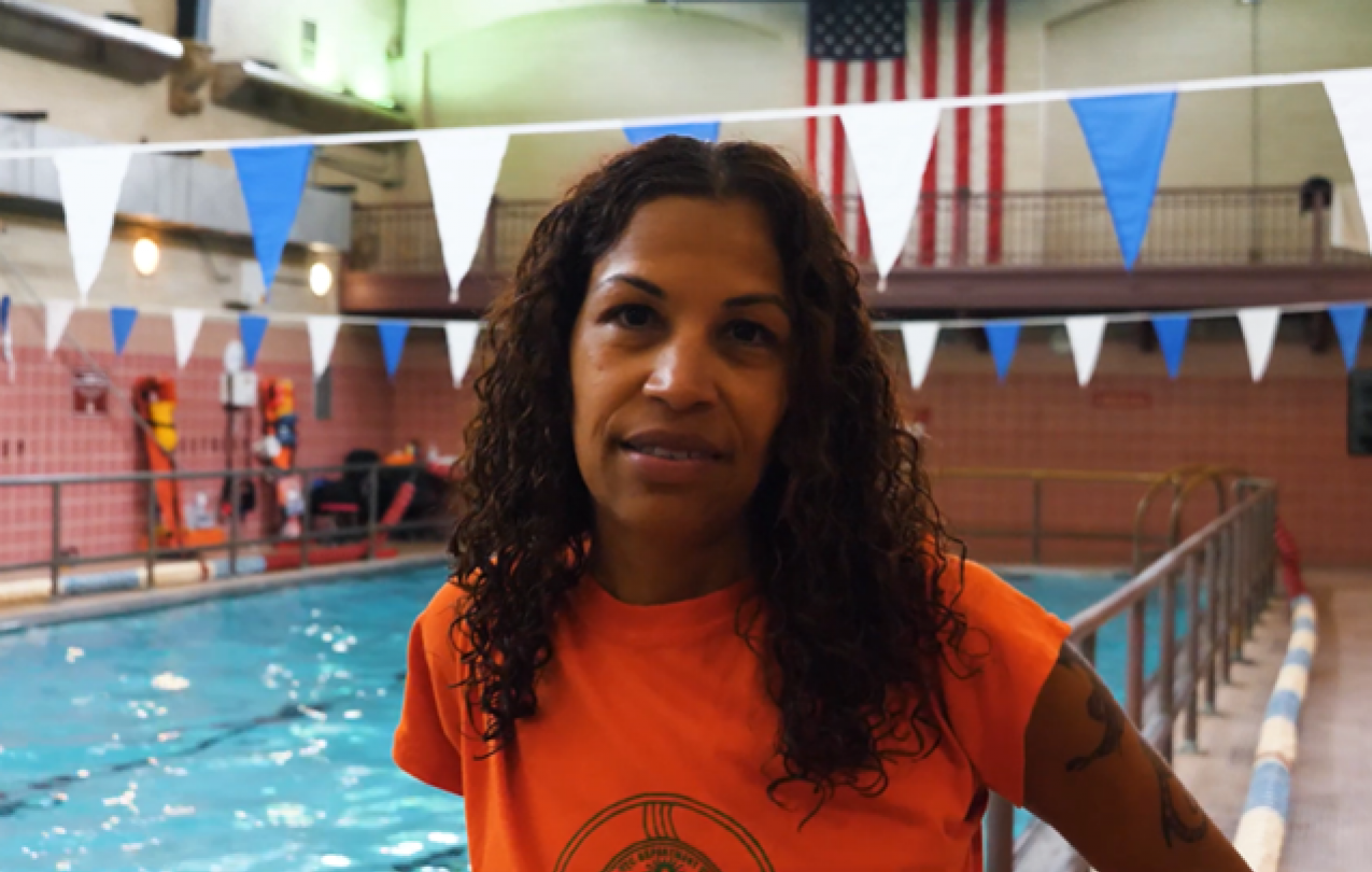 Lifeguard Rosa Pena standing near a pool