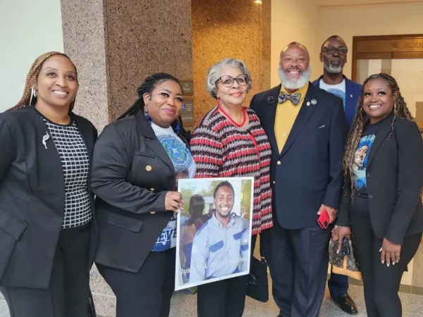 The Motley family with Council 907 Deputy Director Clifton Buchanan and Rep. Senfronia Thompson (center, with glasses), who introduced the Jovian Motley Act. Photo credit: AFSCME Texas Corrections.