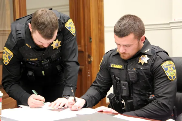 Warren County Sheriff's Deputies of AFSCME Local 1125 review their contract.