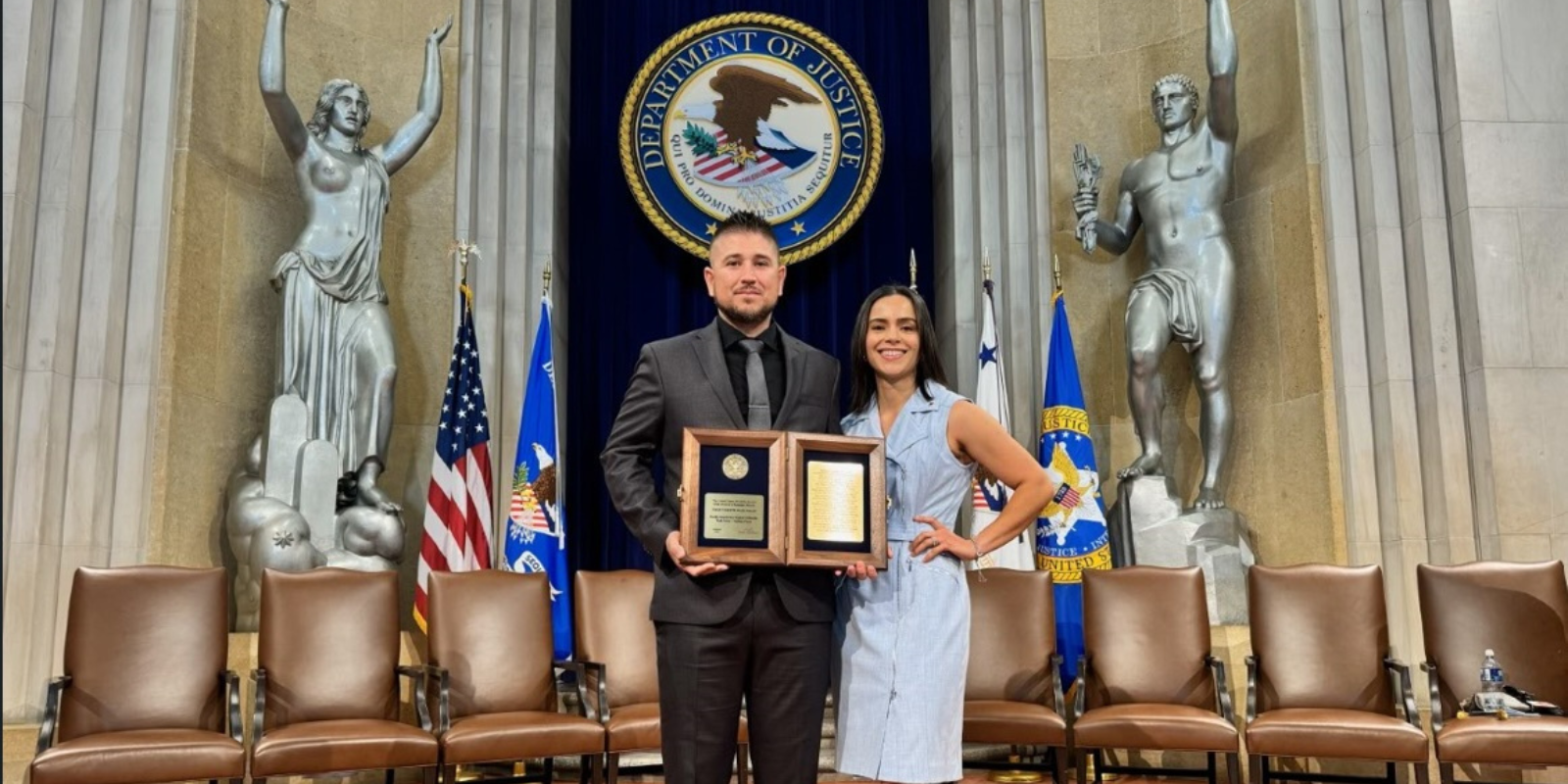 Gonzalez holding an award. Member provided photo.