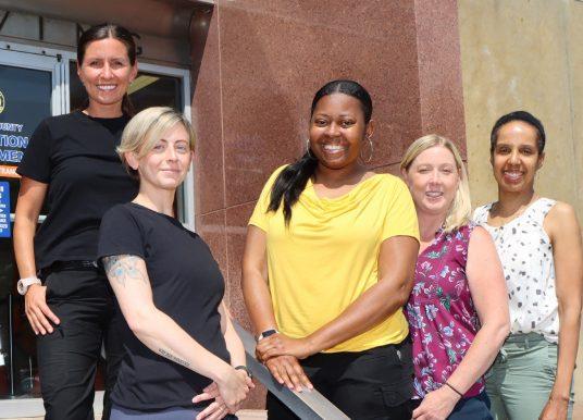 Nassau County Probation Department workers pose in front of a county courthouse. Photo credit: CSEA.